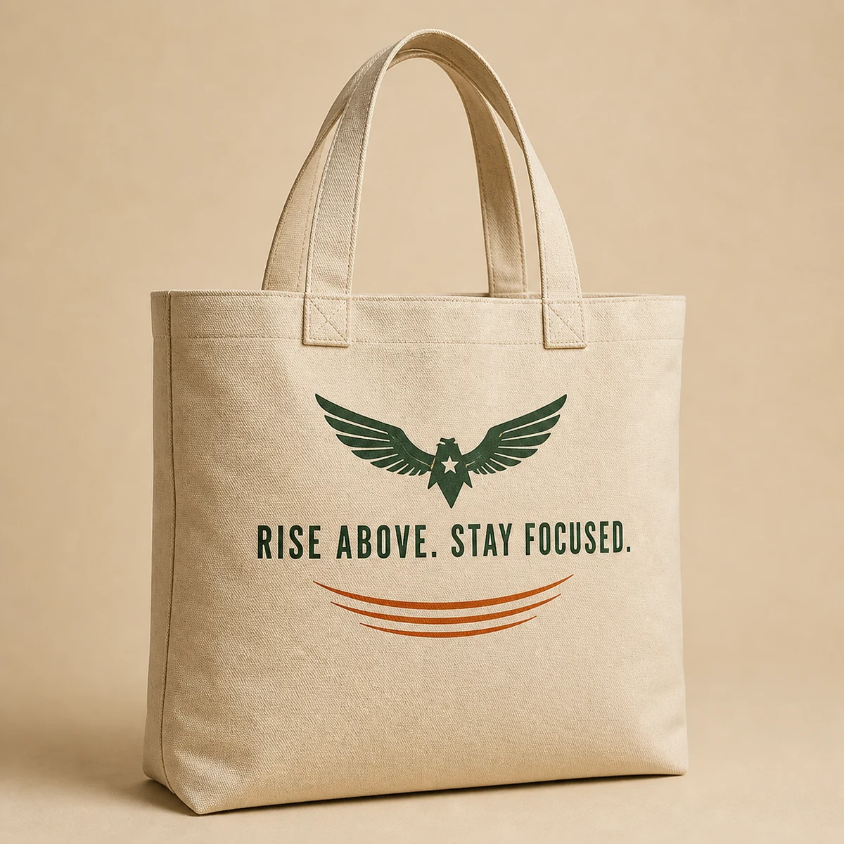 Natural canvas tote with a Hawk Nest mark and Rise Above Stay Focused